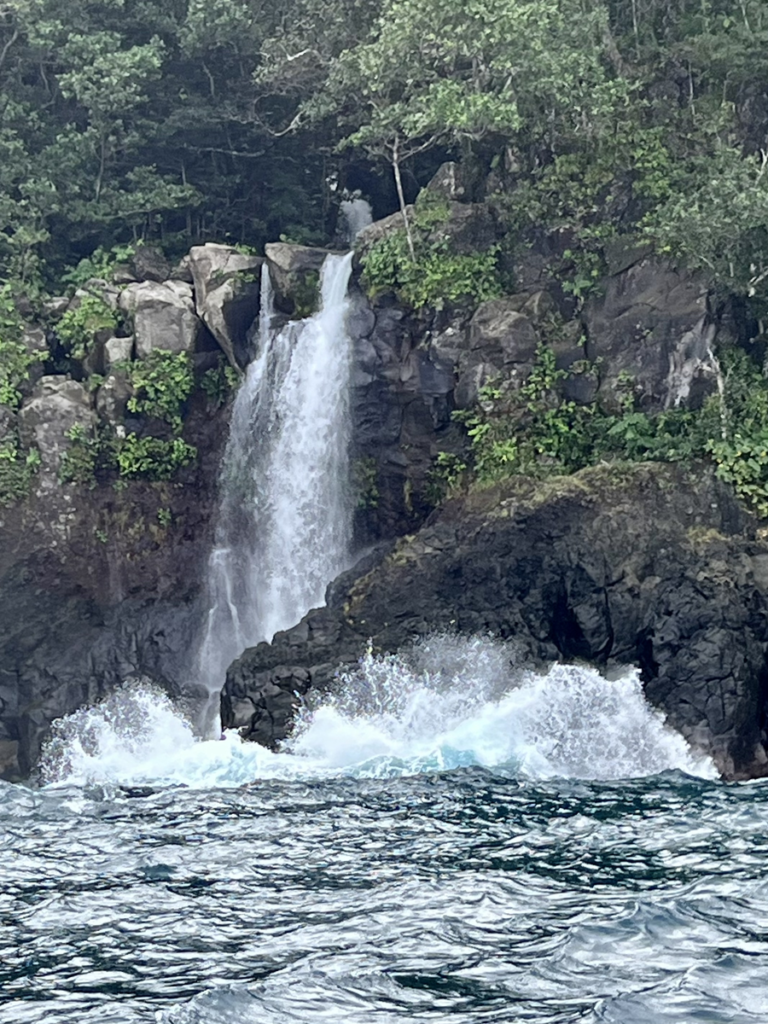 Waterfall cascading into ocean Lavena Coast Taveuni Island Fiji
