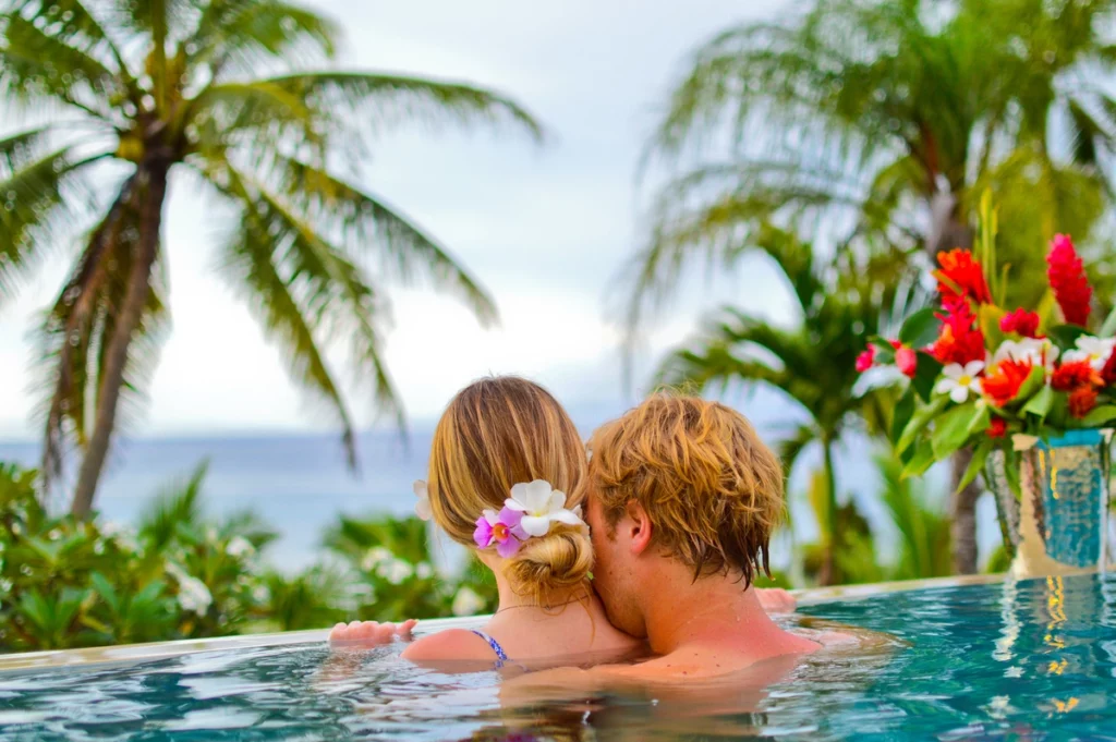 couple enjoying private infinity pool overlooking ocean