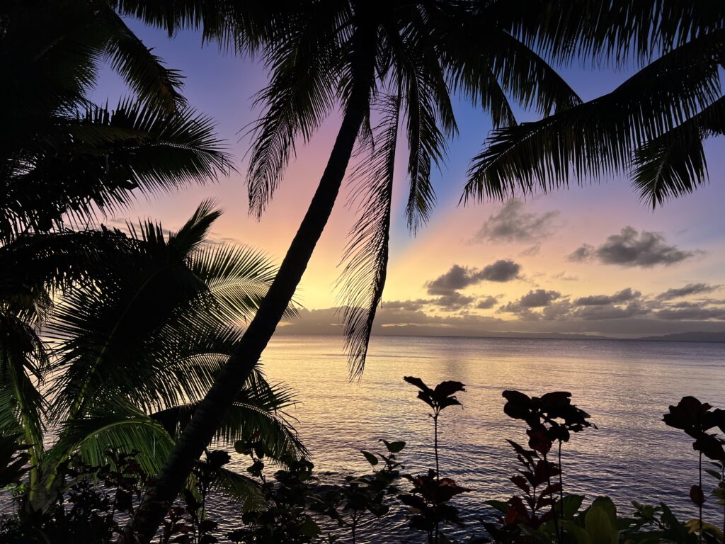Beach Villa pool deck view at sunset overlooking Somosomo Strait Taveuni Palms Fiji